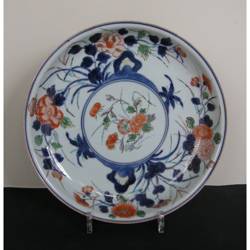Porcelain dish decorated with flowers enameled in green yellow iron red gold and underglaze blue